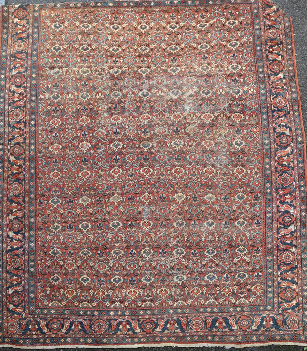 A Mahal red ground carpet, with field of geometric foliate motifs, 386 x 327cm